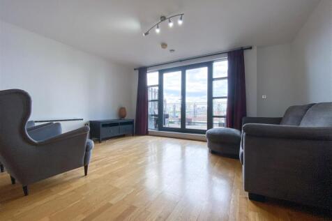 Welcome to this modern apartment located at City Gate 1, Blantyre Street in the desirable area of Castlefield. Spanning an impressive 1,399 square feet, this spacious residence offers a perfect blend