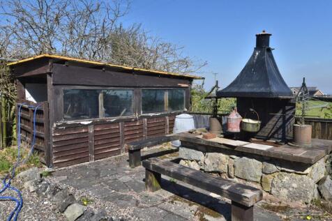 SIDE PATIO WITH SHED AND BBQ