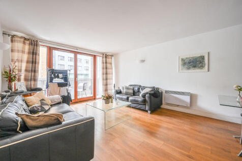 LONG LET. Set within a smart development, this bright two bedroom flat offers ample living space with modern fixtures and fittings, wood floors and balcony.