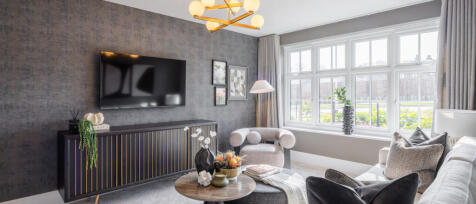 Modern living room with grey textured wall, large window with curtains, contemporary furniture, and