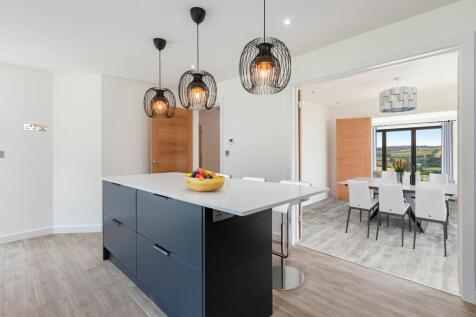 Kitchen into dining then living room