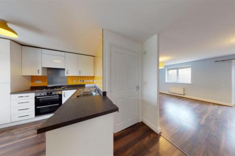 Kitchen through to Living Room