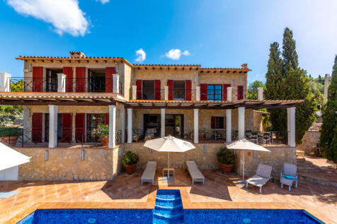 View of the finca with pool and terraces