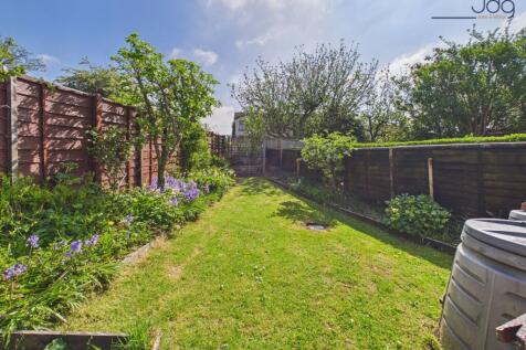 Private, well-established garden with lawn, patio seating and space to grow