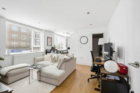 A well presented, modern one bedroom apartment with open plan kitchen and reception featuring wood flooring and neutral decor throughout.