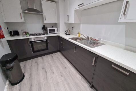 Modern, clean kitchen with ample counter space ...