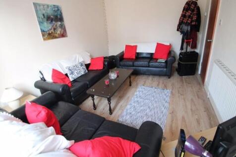 A spacious and stylish living room featuring a ...