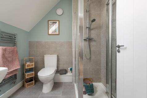 An additional shower room serves bedroom two and four on the top floor