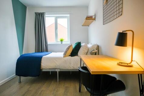 A bright and modern living room featuring a com...