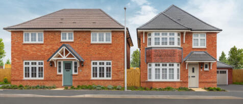 Two modern red brick houses with grey tiled roofs, white window frames, and front doors, separated b