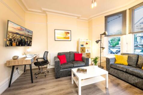 Bright, stylish living room with contemporary g...