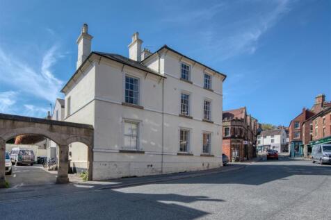 Building and archway to car park.jpg