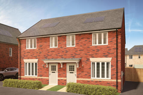 A red brick semi-detached house with white-framed windows and two front doors sits in the foreground