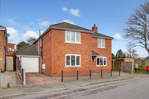 Front of property with garage