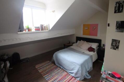 A cozy and inviting bedroom featuring a double ...