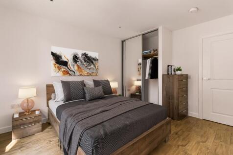 Experience tranquility in this elegantly designed bedroom, featuring stylish decor and ample storage.