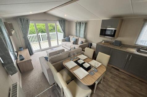 Open Plan Lounge, Dining Area And Kitchen In The W