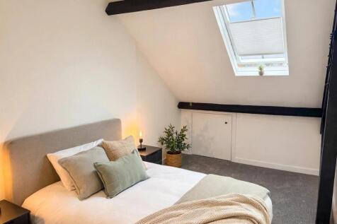 07_Flat52_Bedroom_Velux_Blind_Open_Cushions_Plants