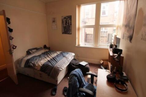 Cozy and functional single bedroom featuring a ...