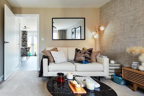 The lounge leads to the open plan kitchen and dining area