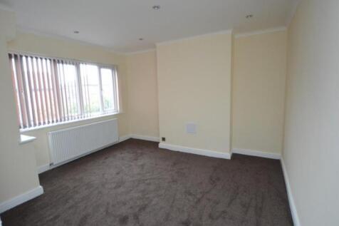 Bright and welcoming living room featuring a la...