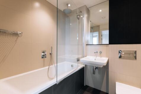 Experience luxury in this elegant bathroom with contemporary fixtures.