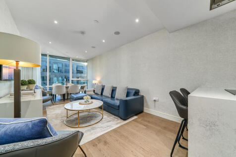 Luxurious 827ft² interior designed apartment with AC, underground parking, Miele appliances & balcony presenting river views.