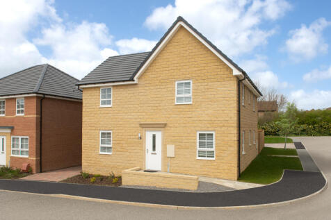 Outside view 4 bedroom detached stone built Alderney home
