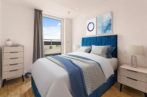 Experience tranquility in this elegantly designed bedroom with a stunning blue and white palette.