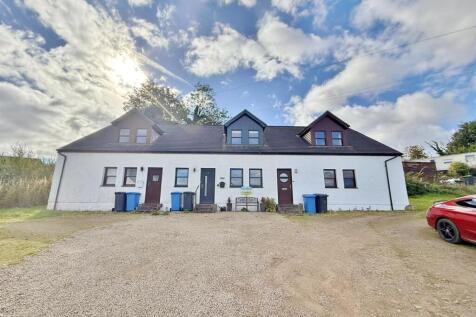 The terrace and parking area to the front