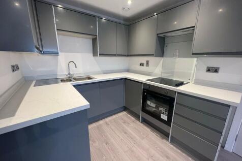 Apartment 24 is a modern, refurbished flat located on Barton Road. The heart of the property is a large open-plan living area that combines a contemporary kitchen with a bright lounge space. From the