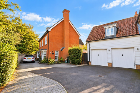 Sunny Suburban Brick Home and Garage.png