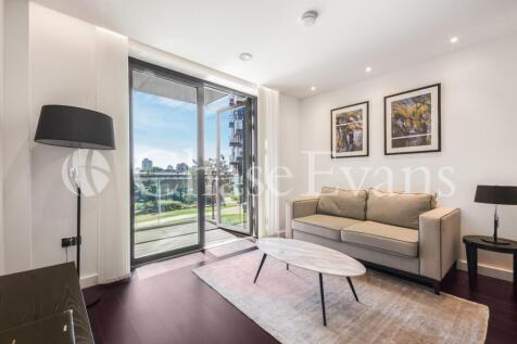 A modern one bedroom apartment with a balcony in The Residence, a recent development in Nine Elms. The property offers an open plan living and features walnut and under floor heating. A large bathroom