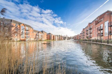 Discover stylish first-floor living in this beautifully presented two-bedroom apartment. Bathed in natural light from floor-to-ceiling windows, it offers a spacious open-plan layout, modern comforts,
