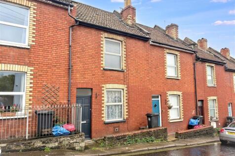 Charming red brick terraced home exterior...