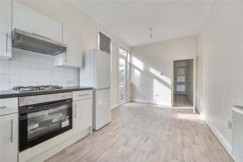 This newly refurbished apartment on the first floor offers stylish and contemporary living, featuring an open-plan kitchen and lounge area, two well-proportioned bedrooms, and elegant wooden flooring