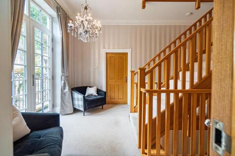 Gracious landings with chandeliers on every level