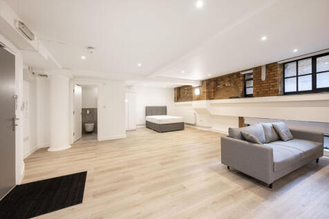 LONG LET. Set in a Victorian refurb, this loft style studio flat is presented in excellent condition with a modern finish and bespoke brickwork. It benefits from sleek open plan living with wooden flo