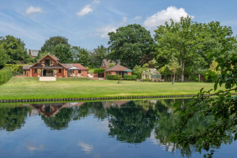 GUIDE PRICE £1,250,000-£1,300,000
Imagine waking up every morning and opening the curtains to look out over your own lake and gardens, teeming with wildlife. You can fish, swim, canoe or simply relax