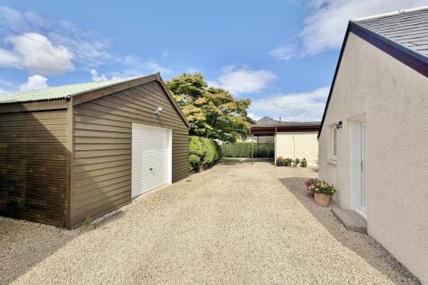 Garage/ workshop and driveway