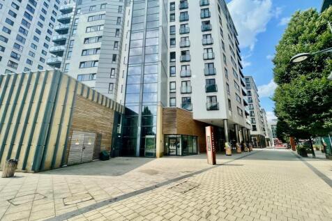 The property offers open-plan living with a fully fitted kitchen (fridge freezer, washing machine, dishwasher, electric hob) and access to a walk-on balcony with views over the dock. Both bedrooms are