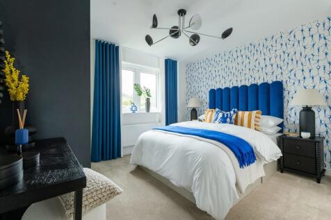 Relax and unwind in the spacious main bedroom with ample storage space