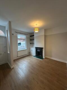 Beautifully renovated two-bed terraced house with modern kitchen, stylish bathroom, private courtyard, on-street parking, and a quiet location near shops and transport.