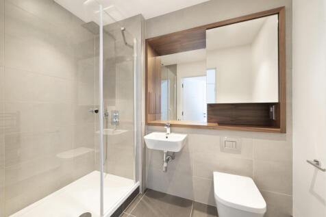 Step into luxury with this modern bathroom design featuring sleek fixtures and a frameless glass shower.