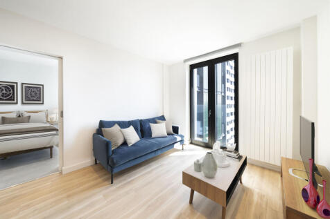 Embrace modern comfort in this chic urban living area, complete with stylish furnishings.