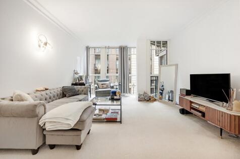 The apartment benefits from a spacious reception room leading onto a balcony, separate fully-fitted kitchen with integrated appliances, large double bedroom with ample wardrobe space and a bathroom wi