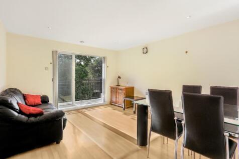 A contemporary and bright two bedroom apartment situated on the first floor of a secure purpose built block, benefiting from wood floors throughout, a balcony and an underground parking space.