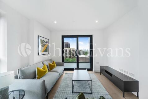 A bright two-bedroom, two-bathroom flat with a balcony in Park & Sayer, close to Elephant and Castle's amenities. The apartment has an open-plan kitchen/living room opening onto the balcony, a master