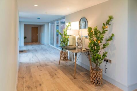 Light and bright hallway connecting the new to the old