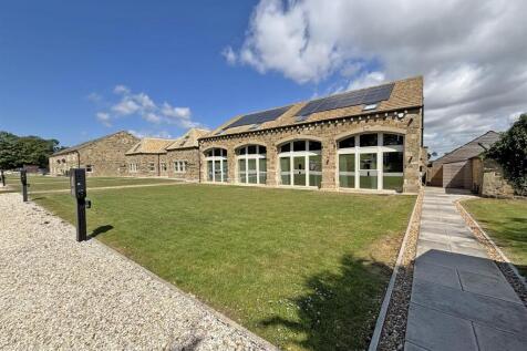 A stunning four bedroom house that has been recently finished to the highest of standards. Set within an exclusive countryside development, approached via electric gates, offering contemporary living